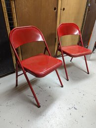 Pair Of Red And An Extra Cream Colored Folding Chairs