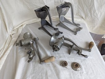 Grouping Of Four Vintage Kitchen Gadgets Including Meat Grinders And Juicers