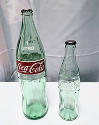 Set Of 2 Vintage Green Glass Coca Cola Bottles With Caps