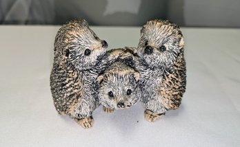 Figurine Of A Trio Of Playful Hedgehogs