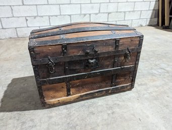 Antique Camelback Trunk On Casters