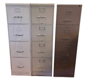 Three Metal File Cabinets