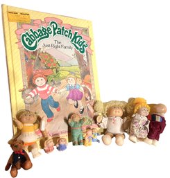 A Group Of Cabbage Patch Dolls Miniatures And Book Circa 1980s