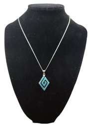 Sterling Silver Chain With A Sterling Silver And Blue Pendant