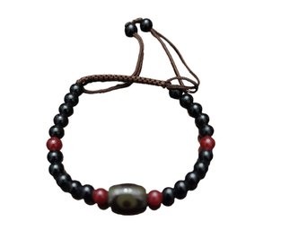 Black Beads With Red Accents Bracelet