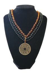 Asian Inspired Pendant On Black And Orange Beaded Necklace