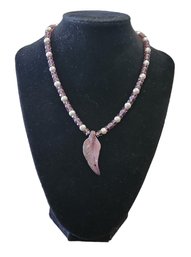 Purple Feather Pendant On Necklace With Purple And White Beads