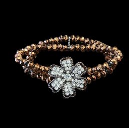 Orange And Black Bracelet With A Rhinestone Flower