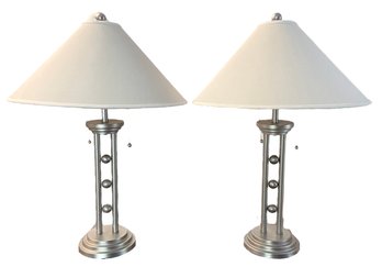 A Pair Of Modernist Brushed Crome Lamps