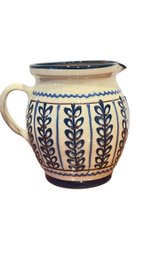 A Blue & Cream Hand Decorated Crackled Finish Pottery Pitcher