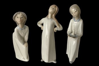 Lot Of 3-Lladro Retired 'girl Stretching' -8', 'Girl Kissing' #4873, 7-1/2', 'girl With Candle' #4868, 8-1/4'