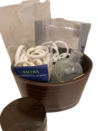 Leather Bound Bucket With Shower Curtain Hangers A Bottle And A Brown Top Container