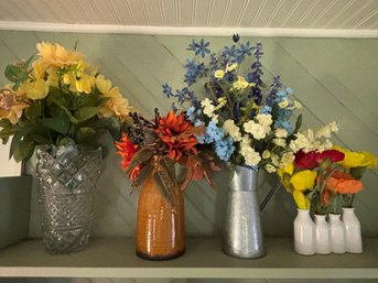 Collection Of Beautiful Faux Flowers In Various Vessels