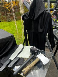 Lil' Grim Reaper With A Table Full Of Tools...