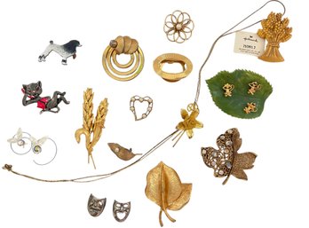 A Collection Of Vintage Gold Tone Pins And More