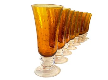 Eight Murano Amber Glass Footed Pilsners