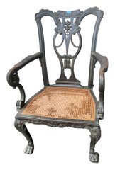 Antique Rococo Style Carved Chippendale Clawfoot Armchair With Cane Seat And Ebony Finish