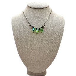 Sterling Silver Figaro Chain Necklace With Green And Black Decorative Bead Center