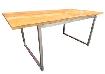 A Solid Oak Dining Table With Brushed Steel Legs