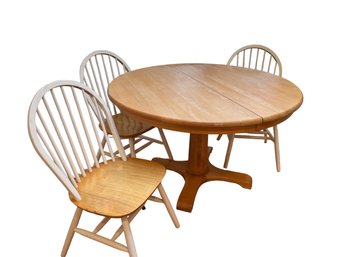 Round Pedestal Base Light Finish Table With  Three White Windsor Chairs