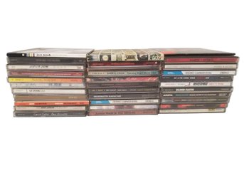 33 Mixed Genre Music CD's: Cat Stevens, John Lennon, Sheryl Crow, Maroon 5, CCR, Cure, Movie Soundtracks & Mor