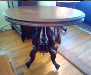 Oval Mahogany Vintage Table With Ornate Legs And Casters
