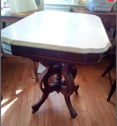 Marble Top Antique Table With Ornate Carved Legs & Metal Casters