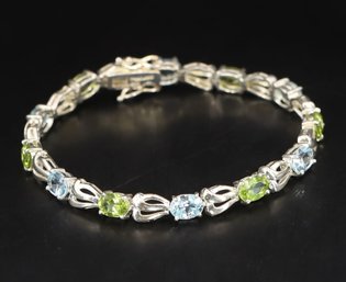 Stunning Peridot & Blue Topaz Tennis Bracelet In Sterling Silver