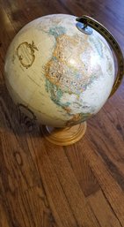 World Globe On A Wooden Base