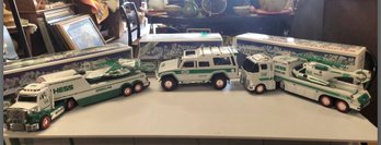 Unused- Clean Trio Of Hess Toy Trucks - Helicopter, Motorcycle Hauler, Truck With Jet Plane             JD/E1