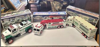 Three Brand New & Clean Condition Hess Toy Trucks- Lights & Sirens-  Fire Truck, Two Race Car & Haulers  JD/E1