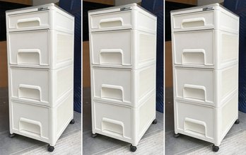 A Trio Of Acrylic Storage Units With Stainless Steel Tops