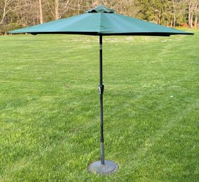 A Large Patio Umbrella On Stand