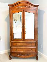 A French Provincial Armoire With Mirrored Paneled Doors By Grange Furniture