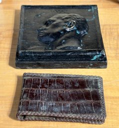 A Vintage Leather Wallet And A Classical Wall Plaque