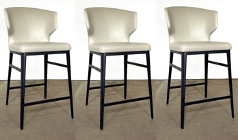 A Trio Of Modern Leather Counter Height Stools