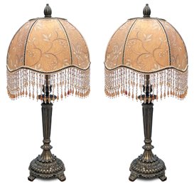 A Pair Of Bronze Accent Lamps With Beaded Shades By Frederick Cooper