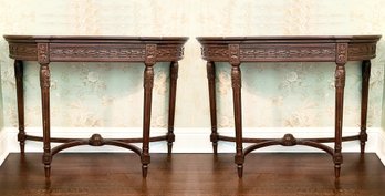 A Pair Of Elegant Louis XVI Mahogany Bow Front Consoles With Carved Details By Louis Solomon