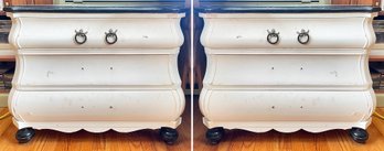 A Pair Of Painted Oak Bombe Form Nightstands