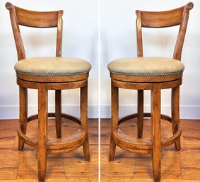 A Pair Of Carved Hickory Leather Bar Stools With Swivel Seats