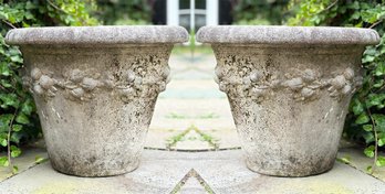 A Pair Of Cast Stone Planters