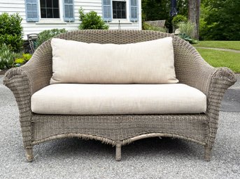 A Faux Wicker Settee With Linen Cushion By Restoration Hardware - B