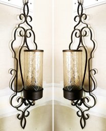 A Pair Of Metal And Glass Wall Sconces