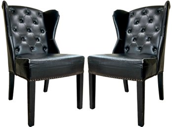 A Pair Of Wing Back Chairs In Tufted Leather And Nailhead Trim By Arhaus