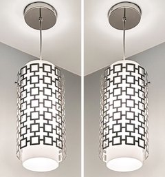 A Pair Of Modern Pendant Lights In Chrome And Frosted Glass