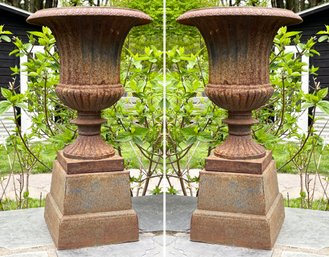 A Pair Of Antique Cast Iron Neoclassical Urns On Plinths