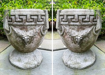 A Pair Of Cast Stone Urns