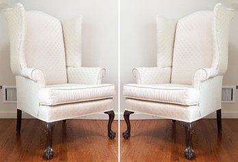 A Pair Of Classic Wing Back Arm Chairs