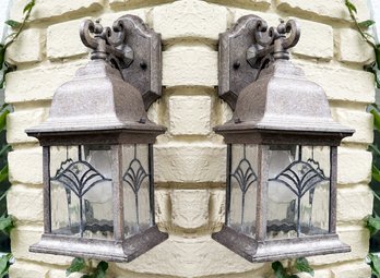 A Pair Of Copper Tone Outdoor Sconces With Leaded Glass