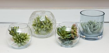 4 Decorative Glass Display Containers With A Variety Of Faux Plants